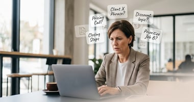 A stressed small business owner at her desk, overwhelmed by a cloud of invisible tasks and judgment calls, illustrating the bottleneck of owner-operated business consulting.
